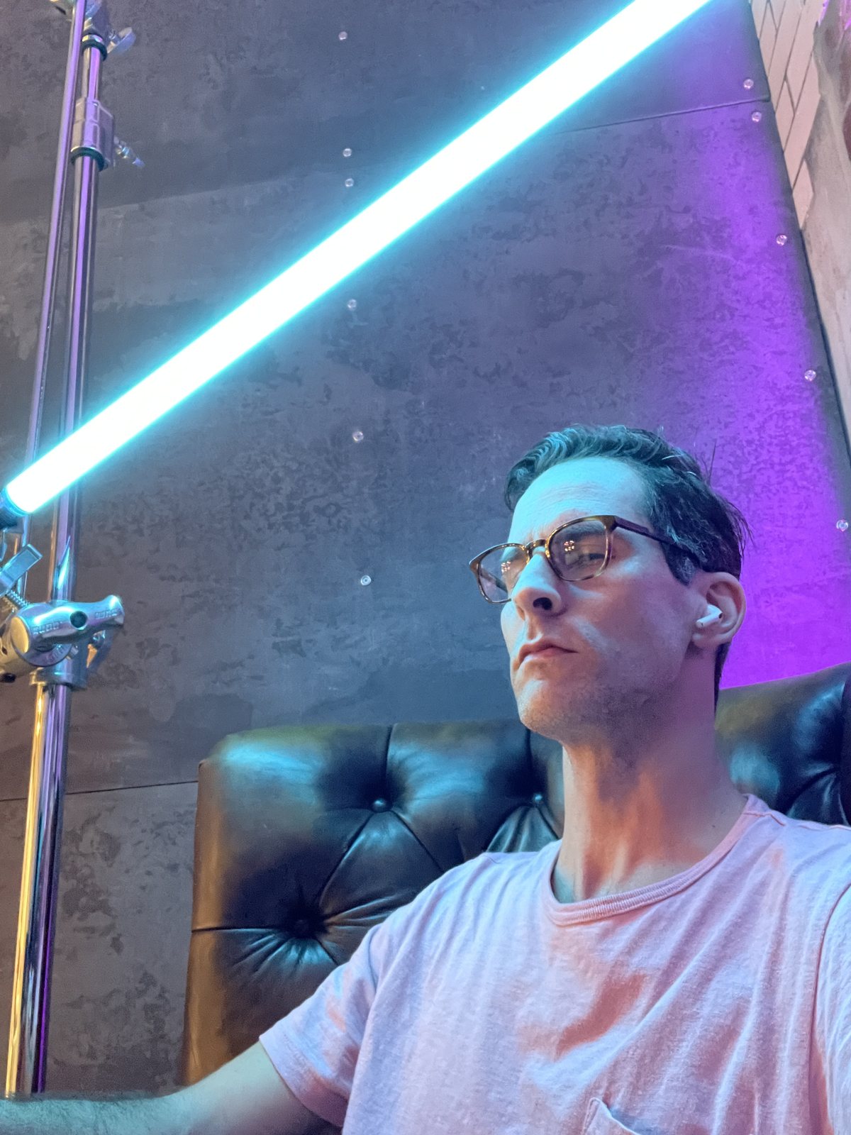 Joel Harrison, lit by a cyan light